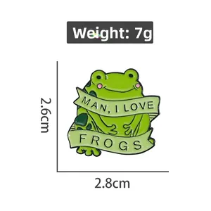 Detail of green frog enamel pin showing 2.8cm size and MAN I LOVE FROGS lettering