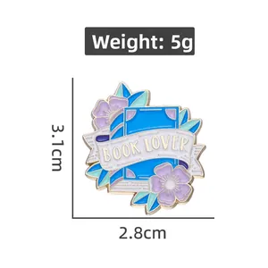 Detail view of Book Lover enamel pin with floral design and 3.1cm size dimensions