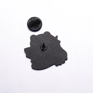 Detail view of the metal pin back and black rubber clutch for the frog alloy brooch