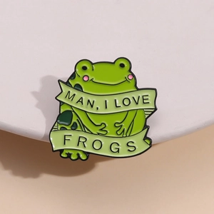 Creative green frog enamel pin badge with 'MAN, I LOVE FROGS' lettering and pink blush