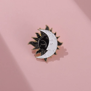Minimalist sun and moon enamel brooch pin with black and white vintage lacquer finish