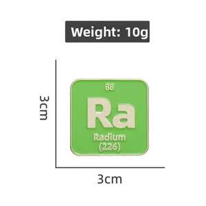 Close-up of green Radium Ra enamel pin showing 3cm dimensions and 10g weight details