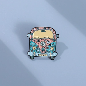 Bohemian retro enamel bus brooch with colorful flowers and peace text on blue background