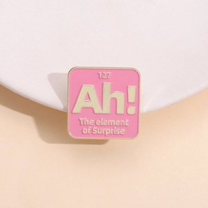 Pink enamel element of surprise chemistry pin badge with gold metal frame