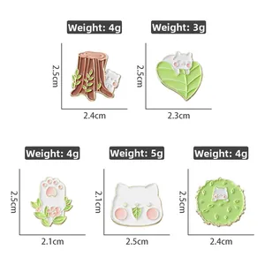 Detailed size and weight specs for cat and leaf enamel pins with dimension markings