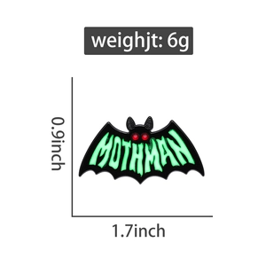 Detail view of Mothman enamel pin with dimensions 1.7x0.9 inch and 6g weight specs
