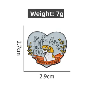 Detail of heart enamel dog pin with 2.7x2.9cm size and Be the person text