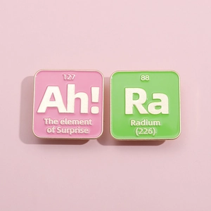 Macaron color metal enamel pin set featuring Ah and Ra chemical element symbols
