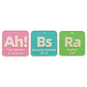 Three colorful science-themed enamel pins featuring element-style designs on white background