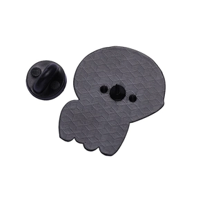 Detail view of the back of ghost brooch with textured finish and black rubber pin clutch