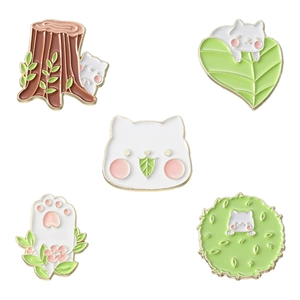 Set of 5 cartoon white cat and green leaf enamel pins with nature-themed metal badges