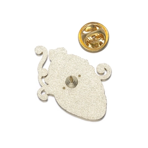 Detail view of the silver frosted metal backing and gold butterfly clutch for enamel pin