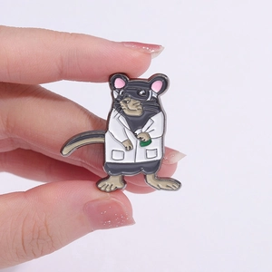 Macro detail of enamel science mouse brooch with lab coat and green liquid flask