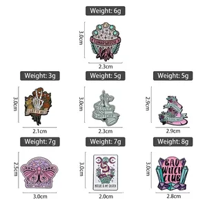 Set of seven gothic enamel pins featuring mystical moon witch and floral skull designs