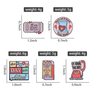 Detail showing colorful enamel pins with dimensions and weight for retro movie tickets