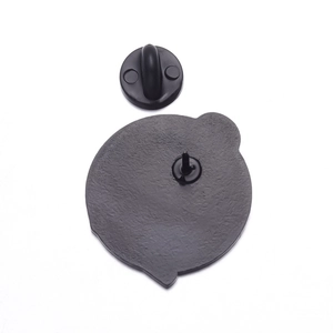 Detail view of the black metal skull brooch back with secure rubber butterfly clutch