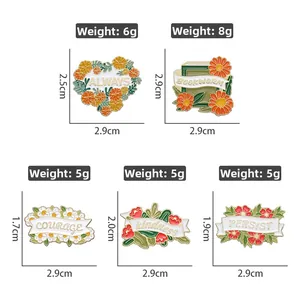 Detailed view of floral enamel pins with motivational quotes and specific dimensions