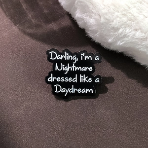 Cartoon enamel cloud brooch with 'Darling, I'm a Nightmare dressed like a Daydream' text
