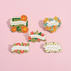 5-piece floral enamel pin set featuring book and daisy motifs on a pink background