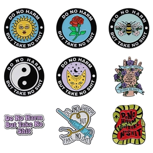 Set of 9 colorful enamel pins featuring bee, rose, and cat with Do No Harm typography