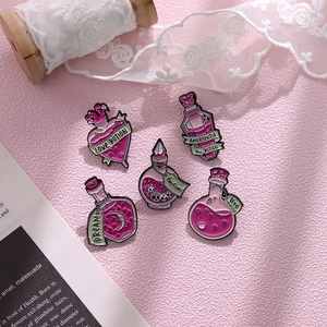 Set of 5 pink magic potion enamel pins featuring Love Potion and Dream designs