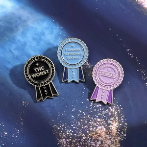 Detailed macro of funny sarcasm enamel lapel pins with social reward medal designs