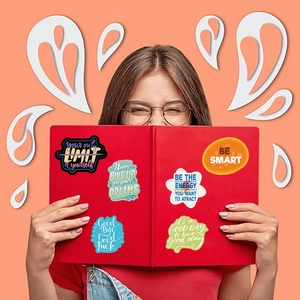 Waterproof inspirational quote stickers on a red book held by a model on orange background
