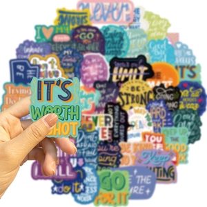 Close-up of waterproof inspirational quote stickers for laptops and luggage decoration