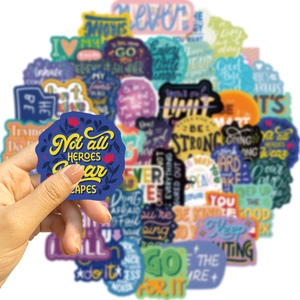 Close-up of waterproof motivational stickers featuring Not all HEROES wear CAPES quote