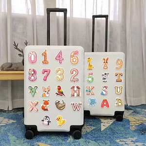 Colorful cartoon alphabet and number waterproof stickers on white suitcases for DIY decoration