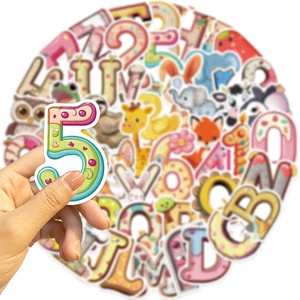 Close-up of hand holding a number 5 sticker from a set of colorful alphabet and animal decals