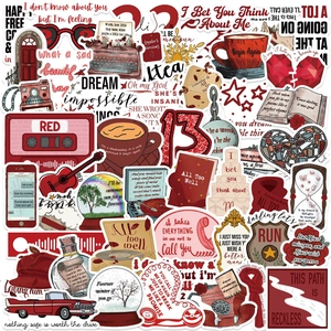 Detailed flat lay of waterproof Taylor Red album stickers with vintage guitar and lyrics