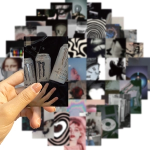 Close-up of waterproof black grunge aesthetic stickers with matte finish for laptops