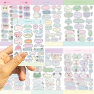 Detail of macaron-colored holiday and monthly planner stickers for DIY journal decor