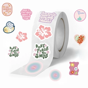 Roll of 500 pink decorative stickers with floral patterns and inspirational quotes