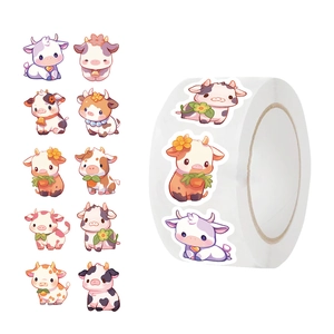Close-up of cute cartoon cow stickers on a roll for scrapbooking and envelope sealing