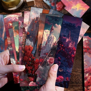 Gros plan de marque-pages roses romantiques avec illustrations de château sur bois