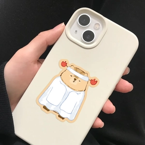 Handheld view of a cream liquid silicone iPhone case with a cute cartoon capybara print