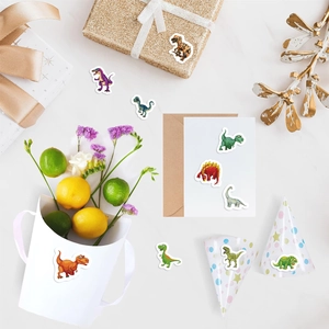 Detailed view of colorful cartoon dinosaur stickers on gift boxes for party decoration