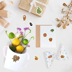 Flat lay of cute cartoon cat food stickers decorating envelopes and gift boxes