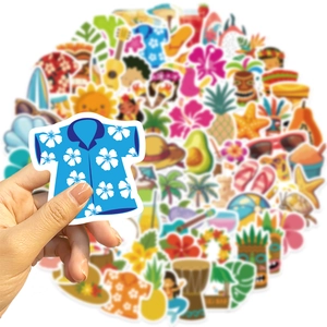 Hand holding a blue Hawaiian shirt sticker from a colorful 100-piece beach decal set