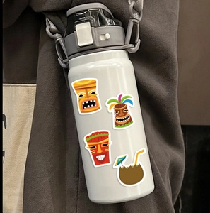 Tropical Tiki mask stickers and coconut drink decal on a white sports water bottle