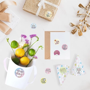 Close-up of cute cartoon dog stickers used for decorating gift boxes and envelopes