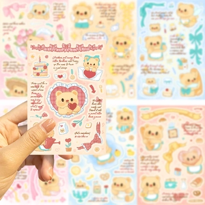 Close-up of waterproof cartoon bear stickers for journaling and DIY crafts