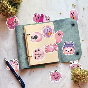 Autocollants Halloween roses avec fantômes et citrouilles sur un carnet pour déco DIY
