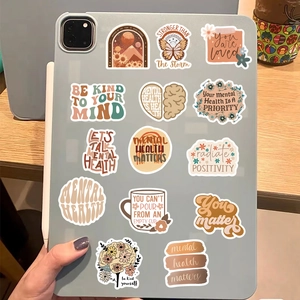 Detail view of boho mental health stickers on a tablet case with soft lighting