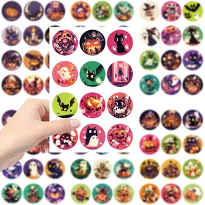 Close-up of circular Halloween stickers featuring pumpkins, ghosts and black cats