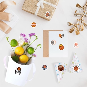 Detailed view of basketball theme stickers on gift boxes and party favors with sports motifs