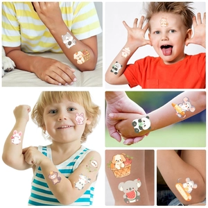 Detailed view of children's temporary tattoos with colorful cartoon animal designs on skin