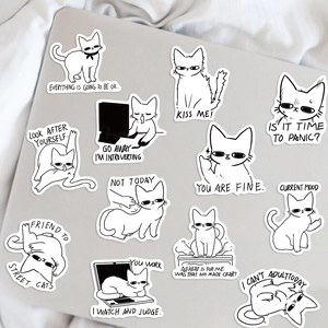 Detail of 12 black and white cartoon cat stickers with funny slogans on a laptop lid